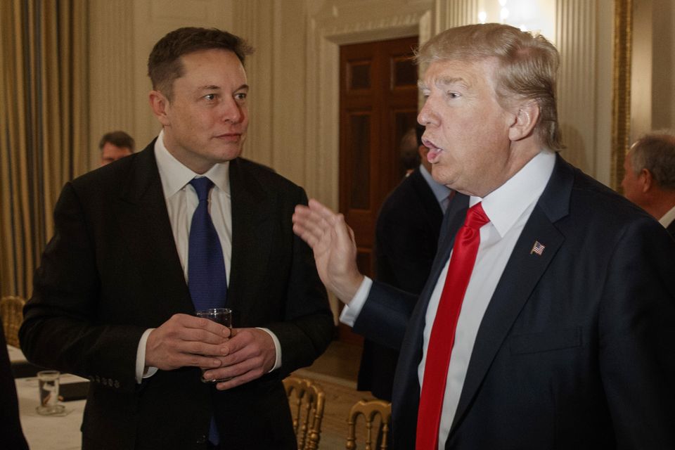 Former president Donald Trump, right, talks with Elon Musk at the White House (AP)