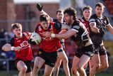 thumbnail: Down's Peter Fegan is tackled by Luke Towey of Sligo during the sides' encounter