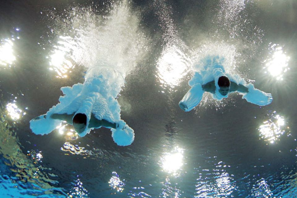 LONDON, ENGLAND - JULY 30:  (L-R) Yuan Cao and Yanquan Zhang of China compete in the Men's Synchronised 10m Platform Diving on Day 3 of the London 2012 Olympic Games at the Aquatics Centre on July 30, 2012 in London, England.  (Photo by Adam Pretty/Getty Images)