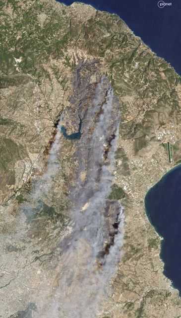 A satellite image showed smoke rising from wildfires in East Attica, some 22 miles north of Athens (Planet Labs PBC via AP)