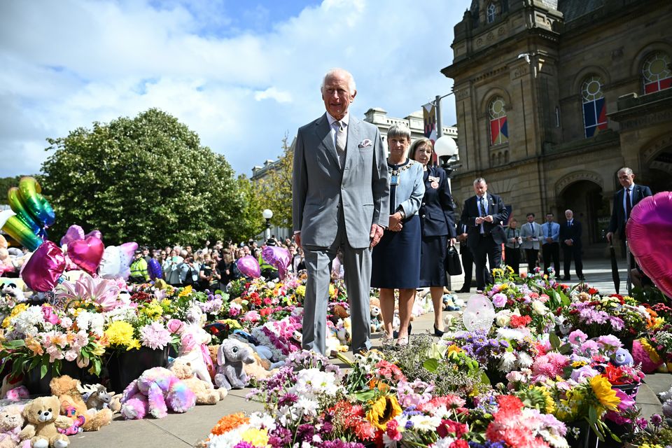 Charles took time to view tributes as he visited Southport (Paul Ellis/PA)