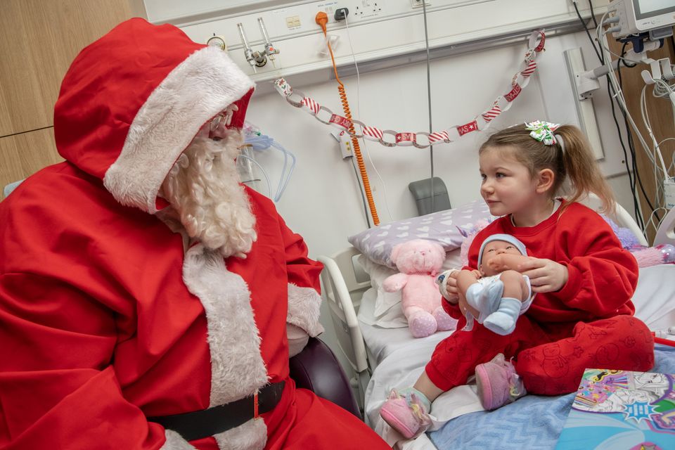 Santa visited several children on his visit, including Millie Sophia Campion (Colm Lougheed/PA)