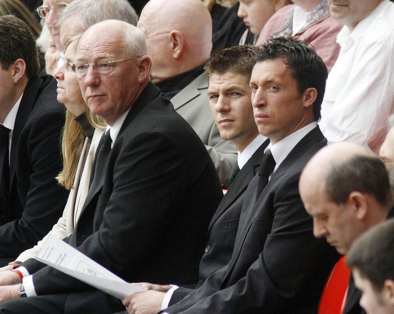 Phil Hammond (left) with Liverpool players Steven Gerrard (centre) and Robbie Fowler at a memorial service at Anfield on the 17th anniversary (Peter Byrne/PA)