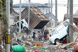 thumbnail: Local residents walk through an area damaged by tsunami after a 9.0 magnitude strong earthquake struck on March 11 off the coast of north-eastern Japan, on March 15, 2011 in Sendai, Japan. The quake struck offshore at 2:46pm local time, triggering a tsunami wave of up to 10 metres which engulfed large parts of north-eastern Japan. The death toll continues to rise with fears that the official death count could well reach up to 10,000 in "the most tragic event in Japanese history since World War Two"