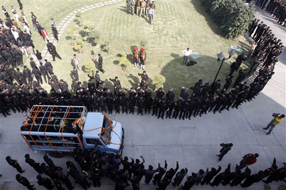 National Security Guard commandoes carry the coffin of commando Gajendra Singh, in New Delhi, India, Saturday, Nov. 29, 2008. Indian commandos killed the last remaining gunmen holed up at a luxury Mumbai hotel Saturday, ending a 60-hour rampage through India's financial capital by suspected Islamic militants that killed people and rocked the nation. (AP Photo/Mustafa Quraishi)
