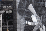 thumbnail: Shadow of a gunman: a boy plays football at a UVF mural on the Newtownards Road in east Belfast