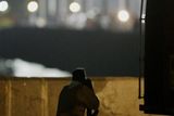 thumbnail: An armed personnel looks on as he keeps watch outside the Taj Palace hotel in Mumbai, India, Thursday, Nov. 27, 2008.  Black-clad Indian commandos raided two luxury hotels to try to free hostages Thursday, held by well-trained heavily armed gunmen, in a coordinated series of attacks.(AP Photo/Gautam Singh)