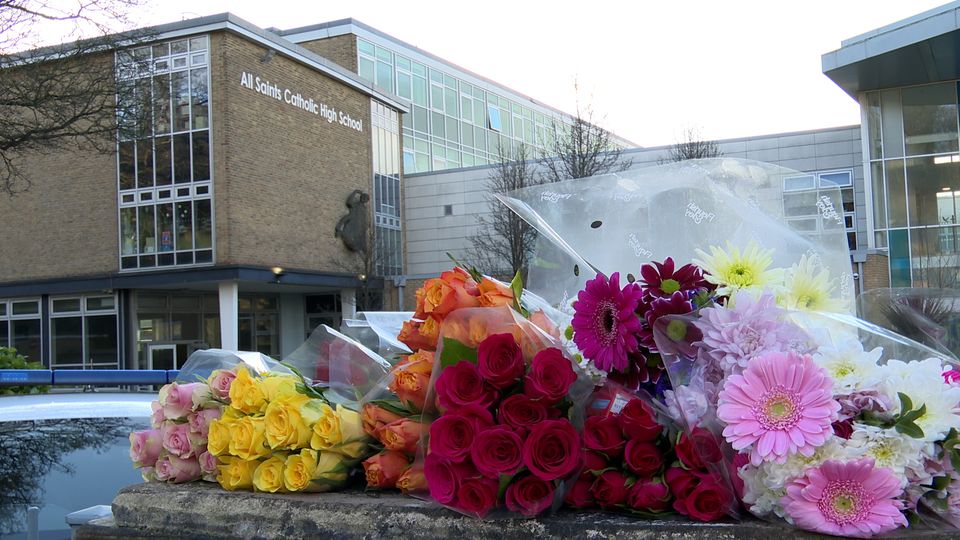 Floral tributes left outside All Saints Catholic High School after Harvey Willgoose died following a stabbing incident (Richard McCarthy/PA Wire)