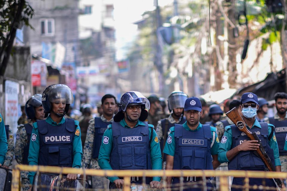 Police officers stand guard outside the Indian High Commission in Dhaka, Bangladesh (Mahmud Hossain Opu/AP)