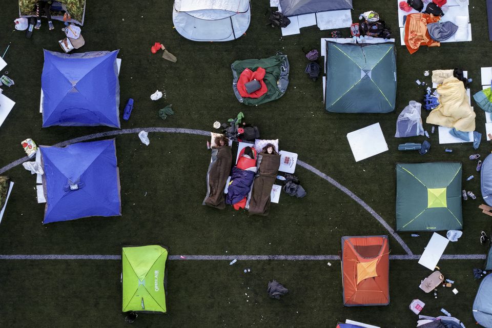 An aerial view of students sleeping in their tents on a soccer stadium as they take part in a march in Serbia (Armin Durgut/AP)