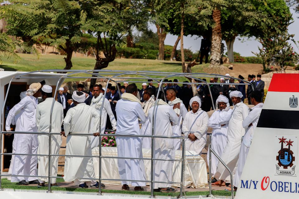 People surround the coffin of Prince Karim Al-Hussaini in Aswan, Egypt (Haytham Fahmy/AP)