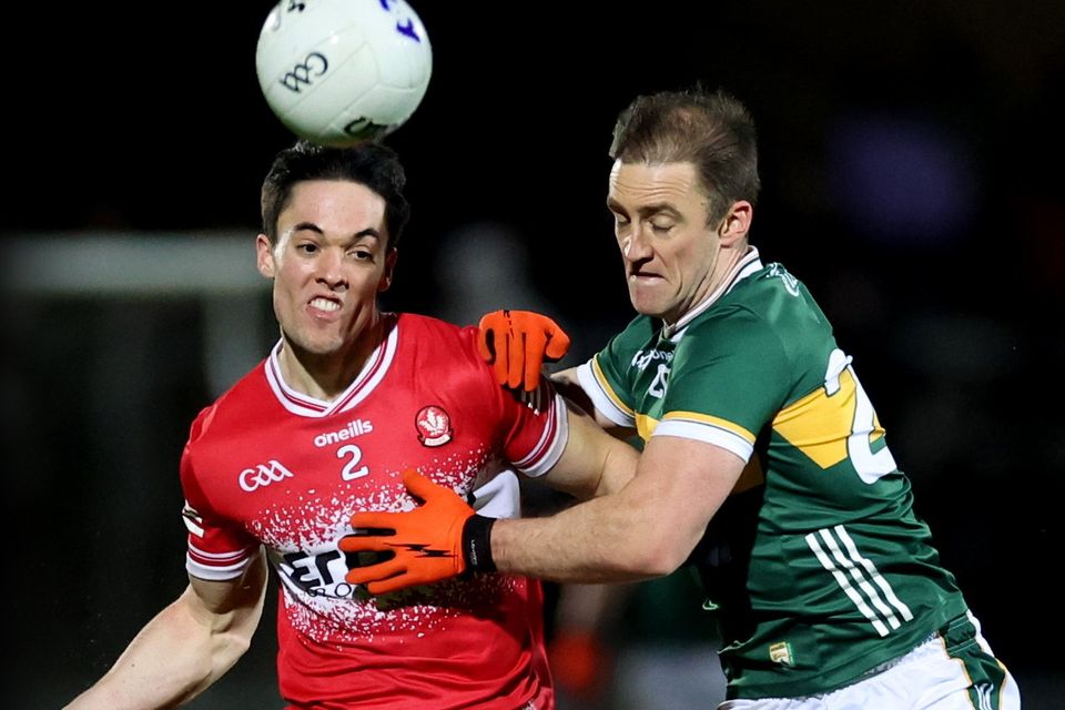 Derry's Conor McCluskey battles with Kerry's Stephen O'Brien during the Oak Leaf County's win