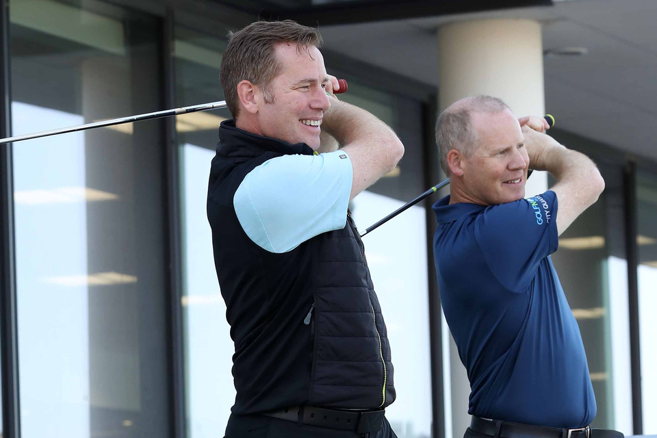 At the official opening of GolfNow's new Belfast offices were, from left, GolfNow's Brian and Rory Smith, co-founders of BRS Golf