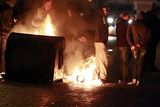 thumbnail: A burning barricade on the Newtownards road area of Belfast, where police have been targeted by rioters