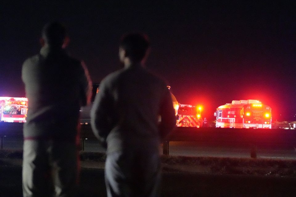 Emergency equipment stages at Gravelly Point, north of Ronald Reagan Washington National Airport, along the Potomac River (AP Photo/Mark Schiefelbein)