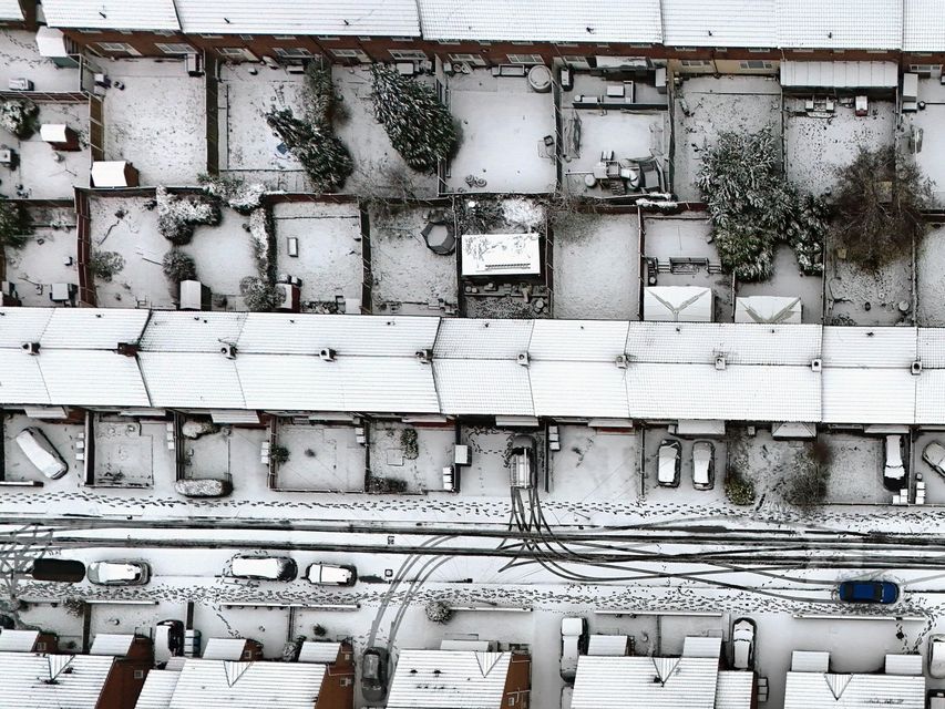 A drone captures the expanse of snow-covered roofs on Merseyside (Peter Byrne/PA)