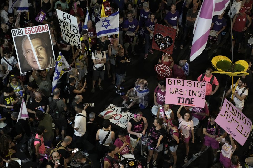 People in Tel Aviv protest against Israeli Prime Minister Benjamin Netanyahu’s government and call for the release of hostages held in the Gaza Strip by the Hamas militant group (Mahmoud Illean/AP)