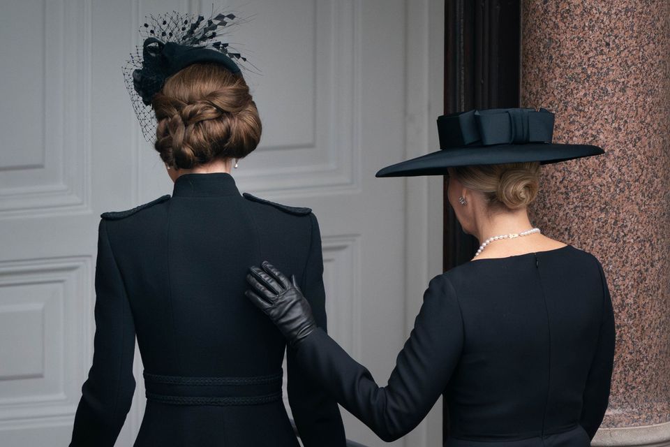 The Duchess of Edinburgh places her hand on the Princess of Wales’s back as they leave the balcony at the Foreign, Commonwealth and Development Office on Remembrance Sunday (Stefan Rousseau/PA)