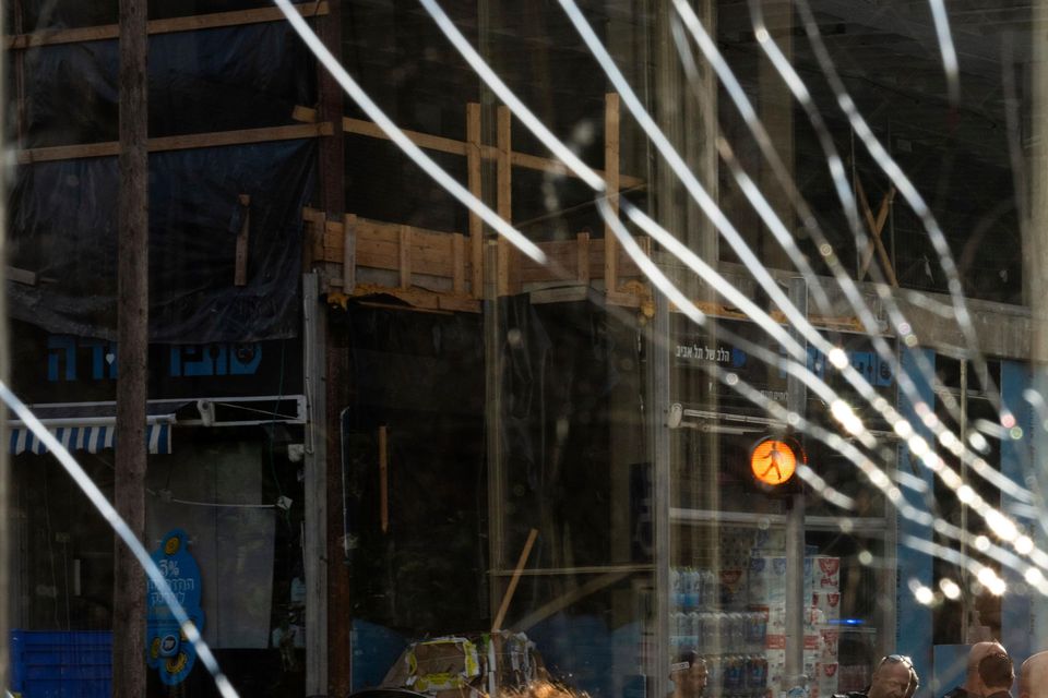 A broken window at the scene of an explosive drone attack in Tel Aviv, Israel, on Friday (Oded Balilty/AP)