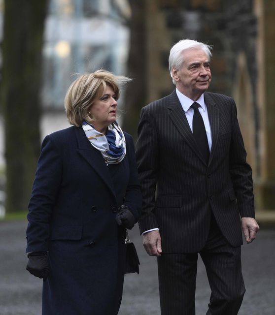 Rose Neil and Paul Clarke attend the funeral of veteran journalist and former UTV political editor Ken Reid (Mark Marlow/PA)