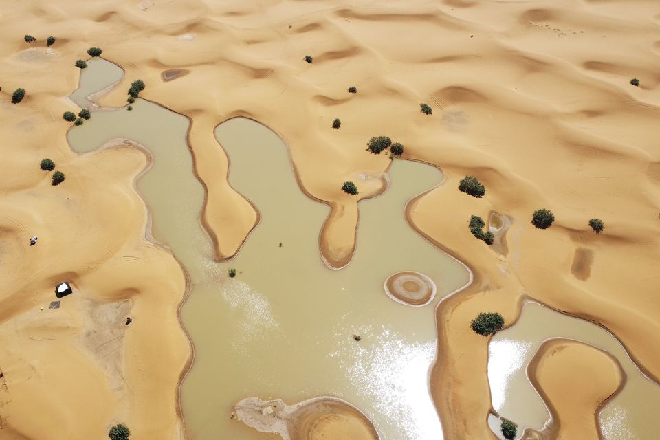 An aerial view of lakes caused by heavy rainfall between sand dunes in the desert town of Merzouga, near Rachidia, in south-eastern Morocco (AP)