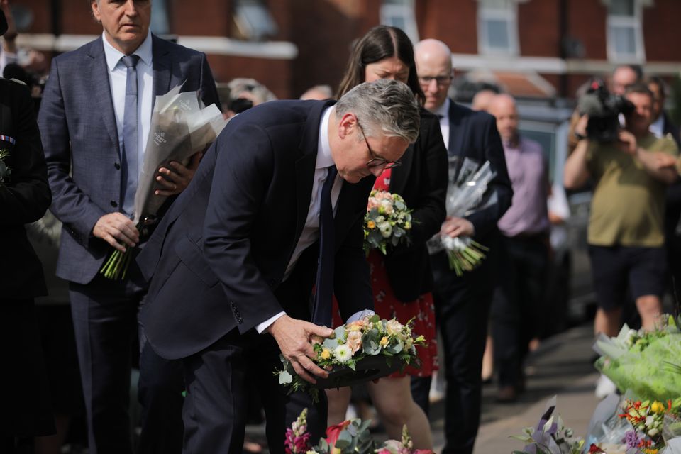 Prime Minister Keir Starmer places a floral tribute near the scene of the fatal knife attack in Southport (James Speakman/PA)