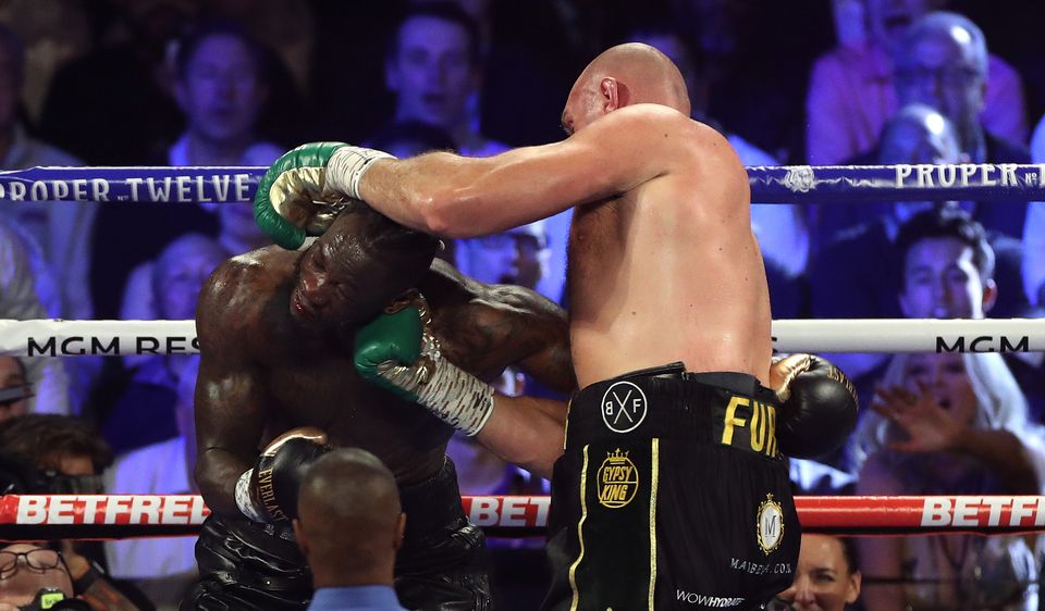 Fury (right) overpowered Wilder in their second meeting (Bradley Collyer/PA)