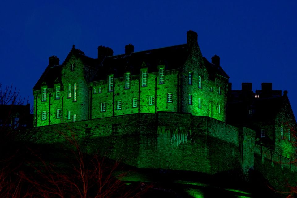 Edinburgh Castle in Scotland illuminated green as it is among more than 100 international landmarks turning green to mark St Patrick's Day.