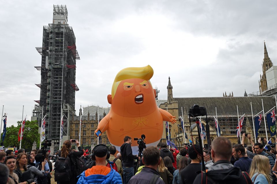 Protesters with the Baby Trump Balloon in Parliament Square during the state visit of Donald Trump in June 2019 (David Mirzoeff/PA)