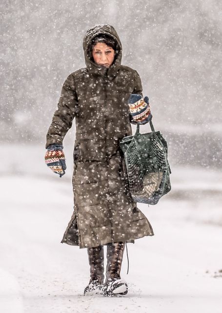 A woman dressed for the snow in Goathland (Danny Lawson/PA)