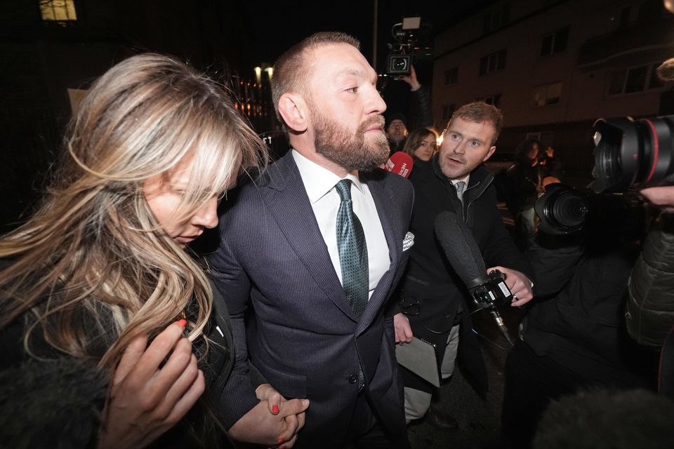 Mixed martial arts fighter Conor McGregor and partner Dee Devlin leave the High Court in Dublin (Brian Lawless/PA)