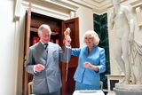 thumbnail: The Prince of Wales and Duchess of Cornwall slice a sponge cake resembling Mount Stewart House, in Co Down, during a tour for the official re-opening of the National Trust property, which has undergone a  refurbishment.
