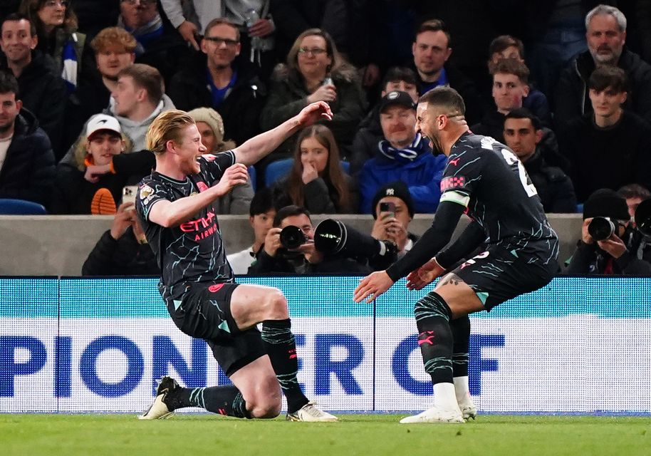 Kevin De Bruyne (left) celebrates the opening goal against Brighton (Zac Goodwin/PA)