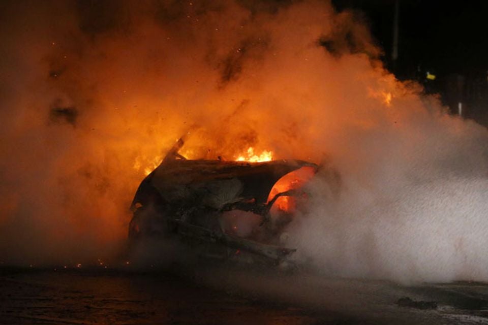 A car burns in the Castlereagh Street of east Belfast