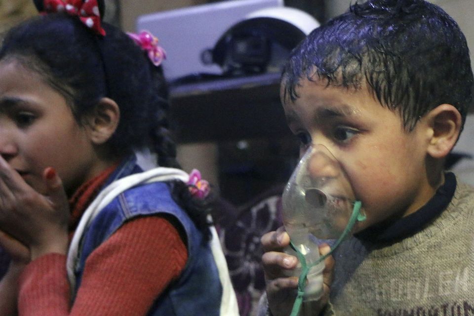 A child receiving oxygen through respirators following an alleged poison gas attack (Syrian Civil Defence White Helmets via AP)