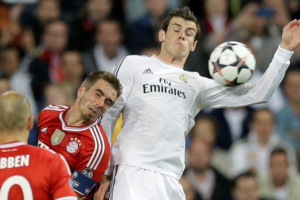 Liverpool's Fernando Torres, right, heads the ball past Real Madrid 's  Pepe, of Brazil, during a Champions League, Round of 16, first leg soccer  match against Real Madrid at the Santiago Bernabeu