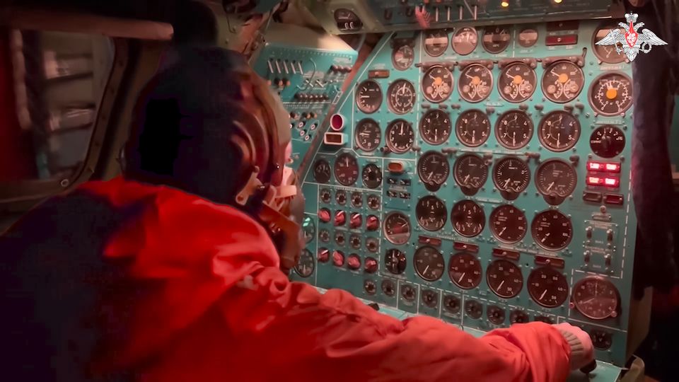 A Russian air force crew member oversees an instrument panel on board a Tu-95 nuclear-capable strategic bomber during drills of Russia’s nuclear forces (Russian Defence Ministry Press Service via AP)