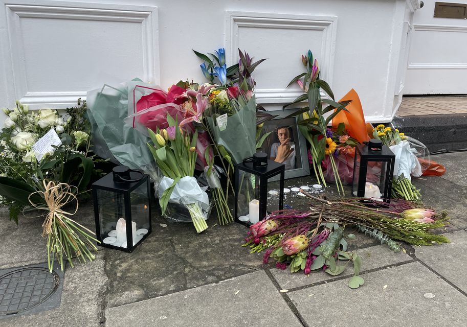 Floral tributes left at the scene on West Street (Claire Hayhurst/PA)