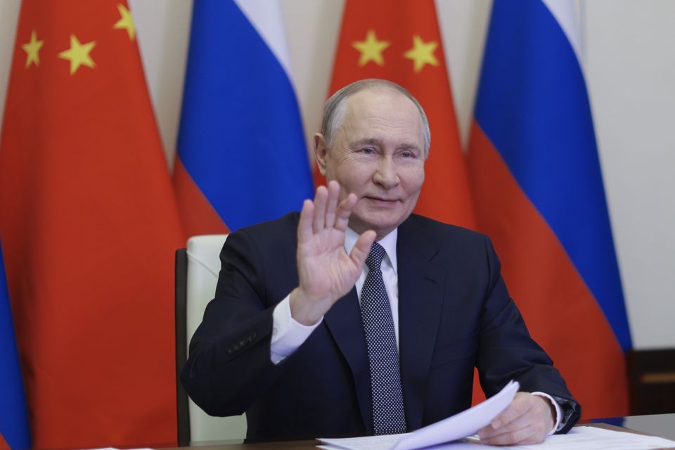 Russian President Vladimir Putin speaks with Chinese President Xi Jinping via video conference in Moscow (Gavriil Grigorov/AP)