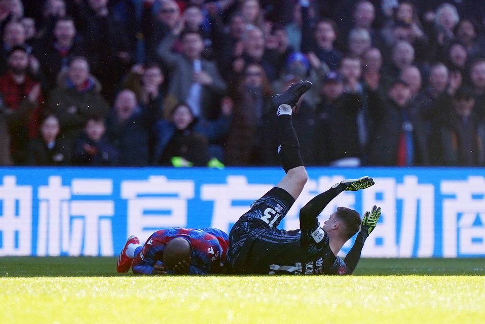 Millwall goalkeeper Liam Roberts clashes with Crystal Palace’s Jean-Philippe Mateta (PA)