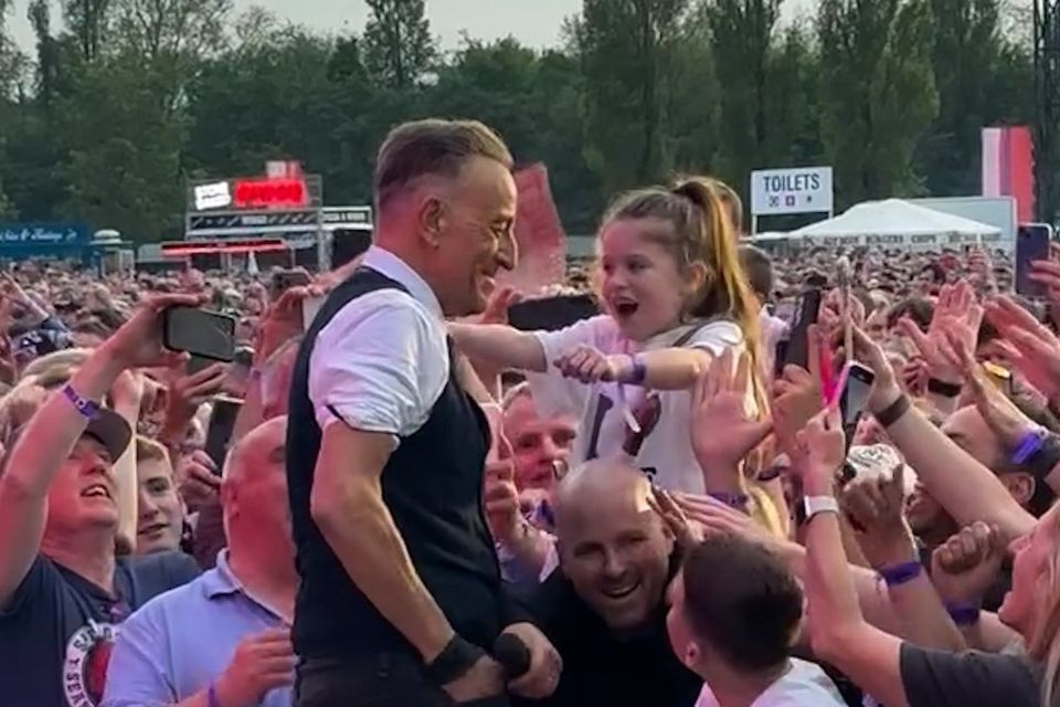 Farrah Lavery reaches out for a hug from Bruce Springsteen at Thursday's concert (Credit: Aiken Promotions)