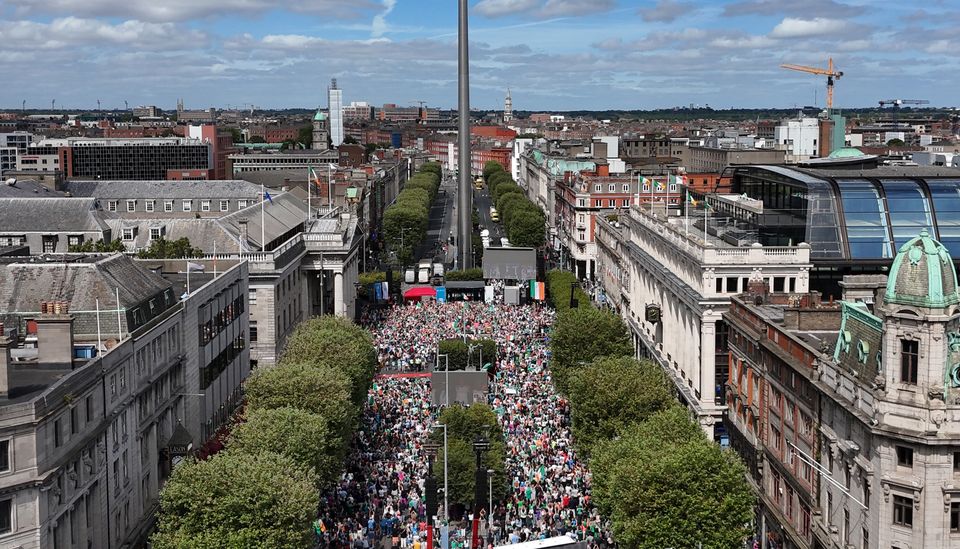 Thousands of people gathered along Dublin’s main thoroughfare to welcome the athletes home (Niall Carson/PA)