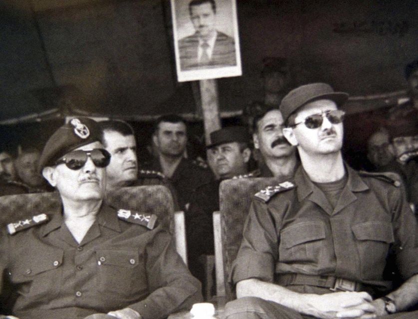 The then president-elect Bashar Assad, right, during military training games in Syria in July 2000 (Sana/AP)