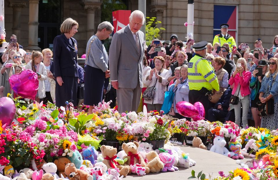 King Charles viewing flowers and tributes outside the Atkinson Art Centre, Southport (Owen Humphreys/PA)