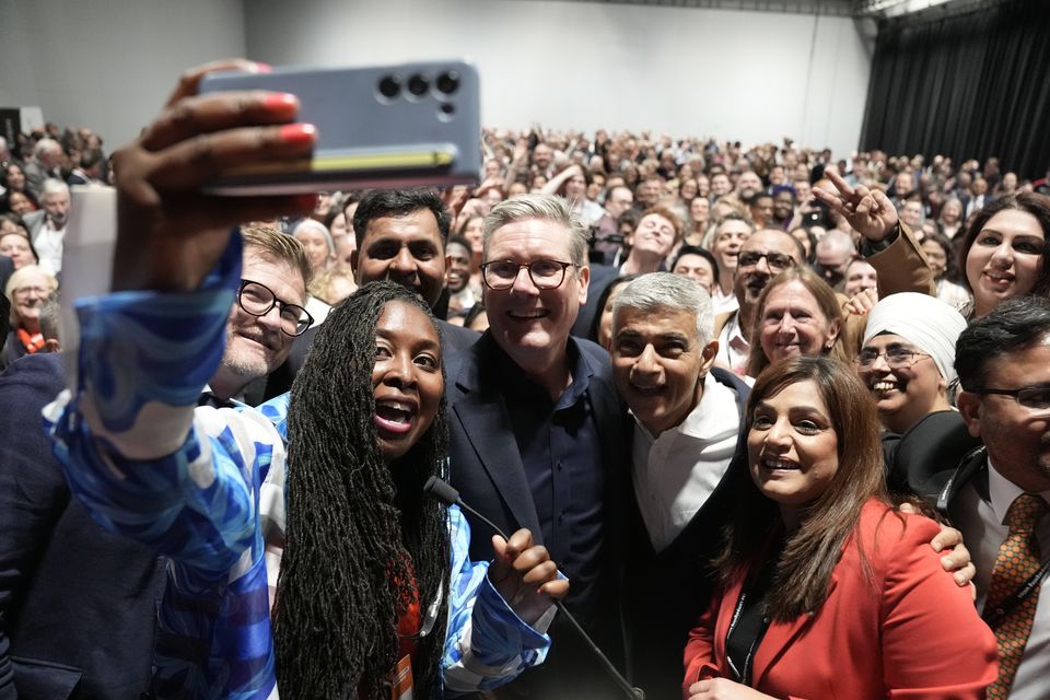 Dawn Butler taking a selfie alongside Sir Keir Starmer, Sadiq Khan and a room of Labour supporters (Stefan Rousseau/PA)