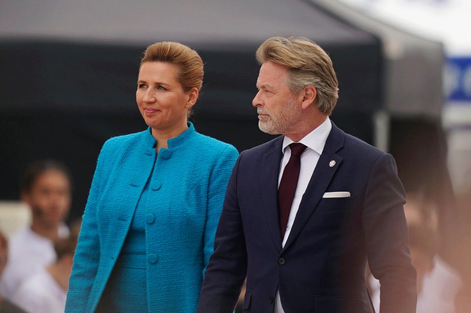 Danish Premier Mette Frederiksen and her husband Bo Tengberg arrive at the official international ceremony to mark the 80th anniversary of D-Day (Jordan Pettitt/AP)