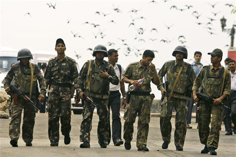 Indian commandos return after the completion of their operation inside the Taj Mahal hotel in Mumbai, India, Saturday, Nov. 29, 2008. Indian commandos killed the last remaining gunmen holed up at a luxury Mumbai hotel Saturday, ending a 60-hour rampage through India's financial capital by suspected Islamic militants that killed people and rocked the nation. (AP Photo/Gurinder Osan)
