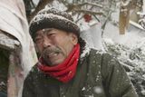 thumbnail: Yoshikatsu Hiratsuka grieves in front of wreckage where the body of his mother is buried in Onagawa, northern Japan Thursday, March 17