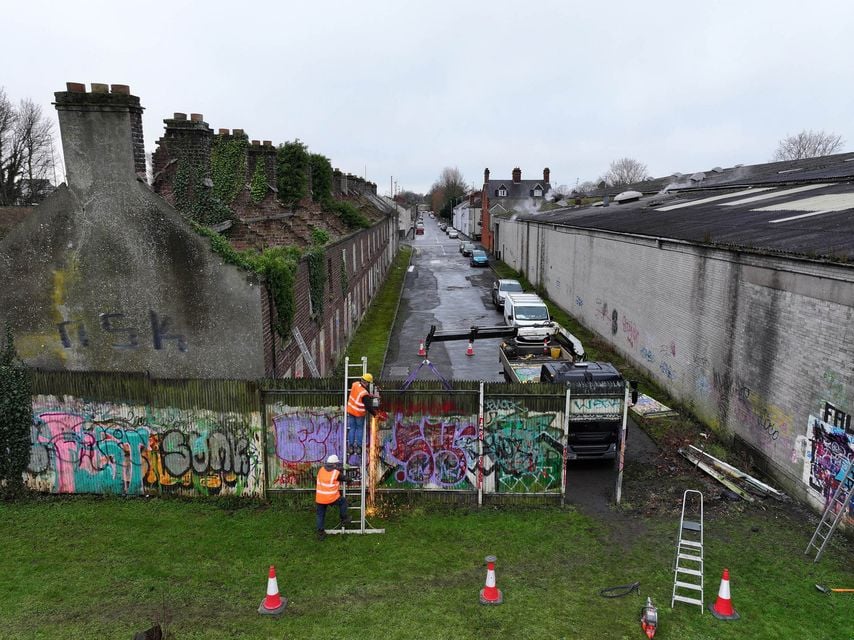 Contractors remove the interface at Water Street, Portadown. Picture: Michael Cooper