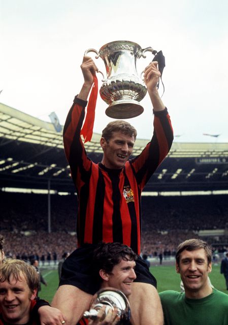 Tony Book is carried on Mike Doyle’s shoulders as Manchester City celebrate FA Cup success in 1969 (PA).